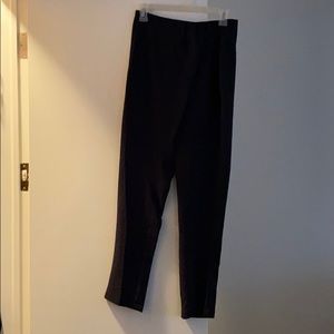 Navy blue dress pants with skirt hanging